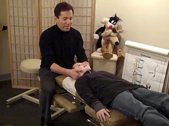Dr. Bruce Indek adjusting a patient on the treatment table