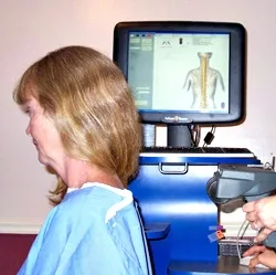 Patient being scanned with the spinal nerve-function equipment